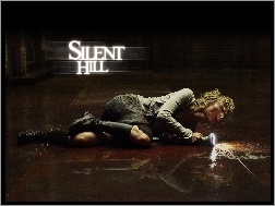 latarka, Radha Mitchell, Silent Hill, leży