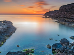 Portinatx, Skały, Latarnia morska, Ibiza, Hiszpania, Punta des Moscarter, Morze Śródziemne, Wschód słońca